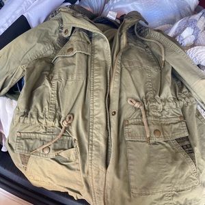 Army green button up jacket with hood.